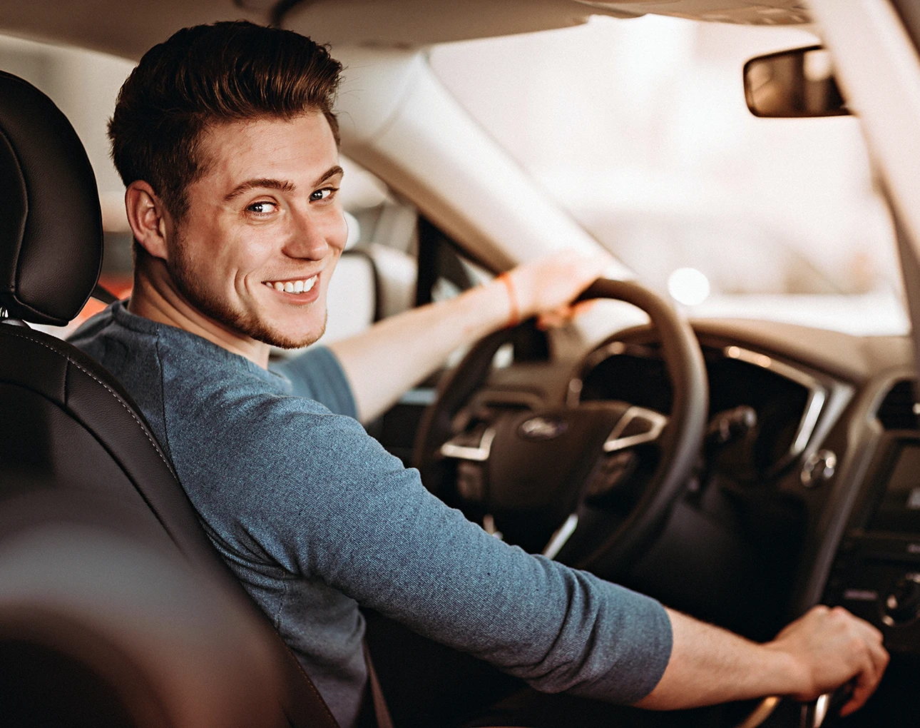 In the driver's seat buying a new car